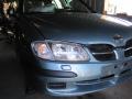 Kuva 1: Nissan Almera 1.8 -02 hb sinivihr. 2002