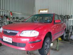 Mazda 323 1,5 -99 sedan punainen