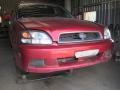 Kuva 1: Subaru Legacy 2,0 -02 4x4 punainen 2002