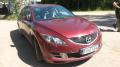 Kuva 1: Mazda 6 2.0 MZR-CD -09 viininpunainen viistoper 2009