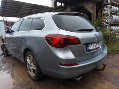 Opel Astra 1,6 aut. -11 harmaa farmari palovaurio keula