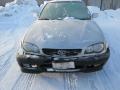 Kuva 2: Toyota Corolla 1.4 Terra sedan -01 ZZE111L-AEMDKW/247 2001