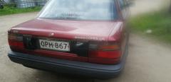 Toyota Corolla 1,3 i-88 sedan viininpunainen