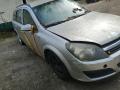 Kuva 2: Opel Astra H 1.8  -06 farmari hopea 2006