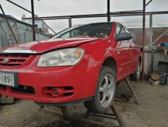 Kia Cerato 1,5 CRDI -05 punainen sedan
