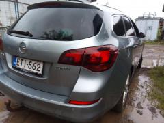 Opel Astra 1,6 aut. -11 harmaa farmari palovaurio keula