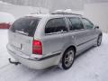 Kuva 3: Skoda Octavia 1U5 5D Combi 1.8T MT5 Ambiente 2004