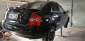 Kuva 3: Kia Cerato 1.6 -06 t-5-ov HB musta 2006