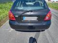 Kuva 5: Nissan Almera (N16) 1.8 5ov. HB -05 2005