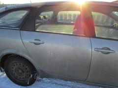 Kuva 1: oikea takaovi, Nissan Primera 1.6 farm. -06