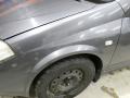 lokasuoja etu  vasen  Nissan Primera StW (WP12) 1.8 2006 115hv 