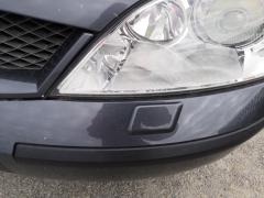 Kuva 1: ajovalon pesimen suutin vasen, Ford Mondeo 2.5 V6 24V farm -02