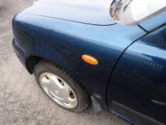 Kuva 1: lokasuoja etu vasen, Nissan Micra 1.3 3ov -99