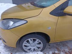 Kuva 1: lokasuoja etu vasen, Mazda 2 1.4 MZR-CD