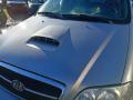 konepelti  Kia Carnival 2.9CRDi -05 