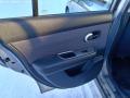 vasen takaovi  Nissan Tiida 1.8 -09