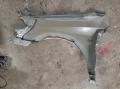 lokasuoja etu  vasen  Nissan Primera (W/P12) 02->>