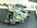 Ilmaläppäkotelo/kaasuläppäkot. AFH38M-08 Mazda 121 88-91